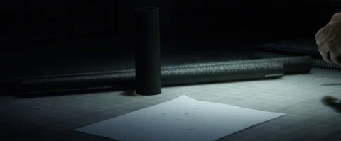 Static Medium Close Up Shot of man measuring carbon fiber tubes Stock Footage 85247778