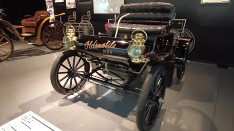 Static medium shot of 1904 Oldsmobile Curved Dash Stock Footage 338285631