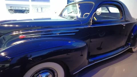 Static medium shot of 1939 Lincoln Zephyr vintage American streamlined sedan Stock-Footage 338285659