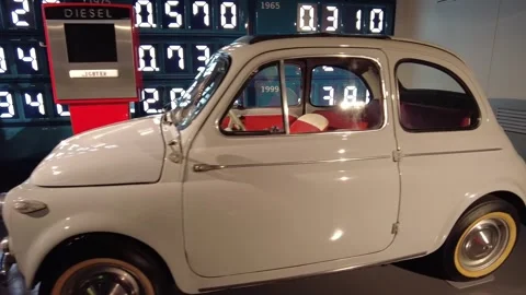 Static medium shot of 1958 FIAT Model 500 classic Italian compact automobile Stock Footage 338285635