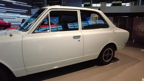 Static medium shot of 1969 Toyota Corolla classic Japanese compact sedan Stock-Footage 338285634