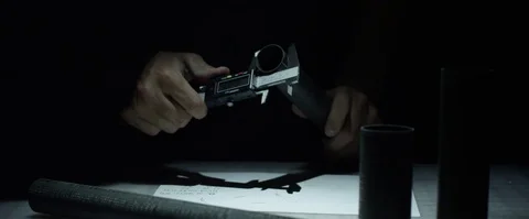 Static Medium Shot of man measuring carbon fiber materials and writing notes Stock Footage 85236716