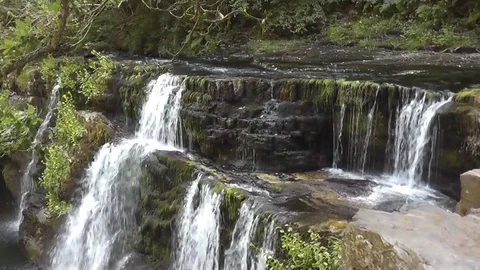 Static medium shot of wide waterfall in Wales Video stock 92576381