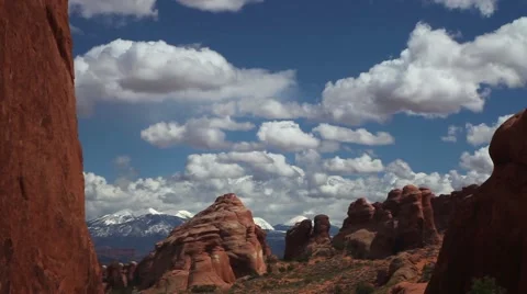 Static MS red rock formations, blue sky, white clouds moving Stock Footage 41750744