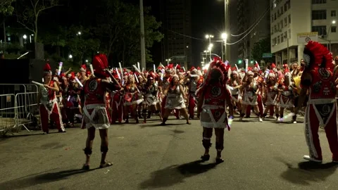 Static night shot of performers dancing in costume during a Rio de Janeiro Stock Footage 336073568