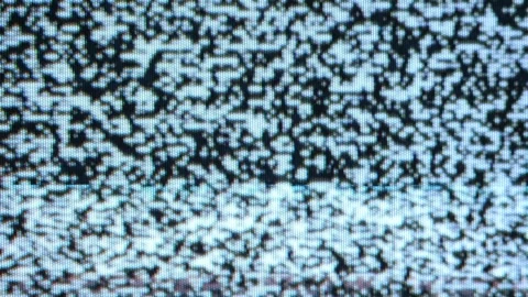 Static noise on an analog television screen. The chaotic pattern consists of Stock Footage 265268444
