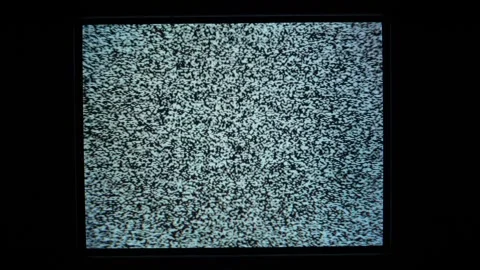 Static noise on an analog TV screen, signal lost. Zoom out. Stock Footage 317904207