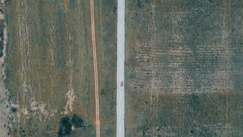 Static Overhead 4K Drone Footage: Scenic Road and Empty Fields at Prespes Lakes Stockbeeldmateriaal 241899702