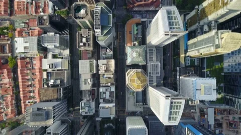 Static overhead drone shot of commercial office buildings downtown Singapore 動画素材 78584759