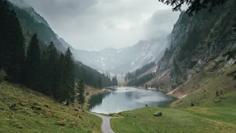 Static panorama time lapse of a beautiful rural lake in the alps of Switzerland Video stock 193917295