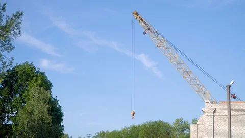 Static plan of the construction crane on the background of construction Stock Footage 109067451