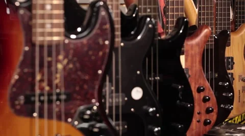 Static rack focus bass guitars Stock Footage 56036374