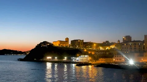 Static real-time footage of the promontory of Piombino with the lights of the ci Stock Footage 143572425