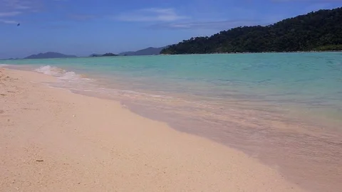 Static scene. Blue sky and sand. Sea water, waves. Shot in Koh Lipe Island in Stock Footage 83214501