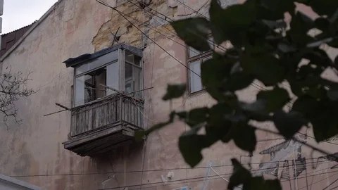 Static shoot of old building with crashed balcony with green leaves Stock Footage 77237854