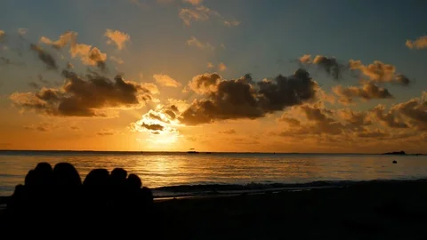 A static shoot with on a sunset on a paradisiacal beach, with the Stock Footage 115332051