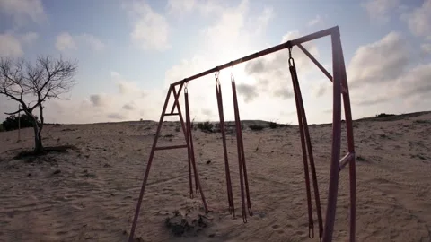 Static Shot of Abandoned Swing on White Sand Dunes Desert, Vietnam Stock Footage 340964310