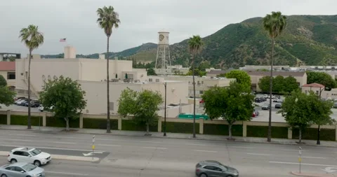 Static shot of Aerial pull-back shot of Warner Brothers WB Water Tower &amp; Traffic Stock-Footage 242861979