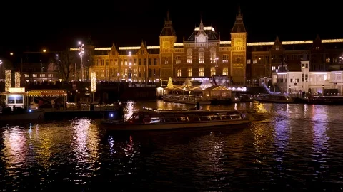 Static Shot of Amsterdam Central Station at Night as Ferries and Boats 動画素材 105420214