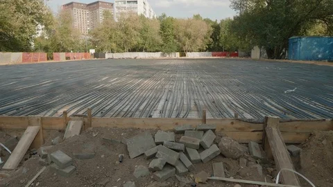 Static shot of balck plastic tubes on ground covered with concrete. Future Stock Footage 120732191