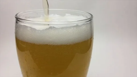 Static shot of beer being poured into a pint glass Stock Footage 87857737
