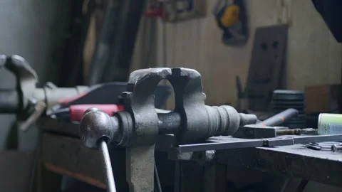 Static Shot of Bench Vise on Workbench – Tools and Workshop in Frame Stock Footage 313850013