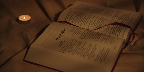 Static shot of bible with candle Stock Footage 126077963