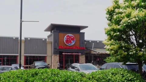 Static shot of Boston pizza restaurant entrance, a Canadian pizza chain Stock Footage 244962334