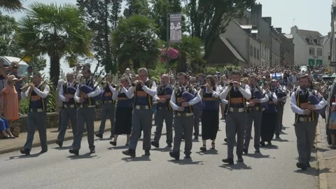 Static shot of Breton cultural parade with bagpipes and traditional dress Stock Footage 342020286