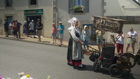 Static shot, bright midday, Breton cultural festival parade with traditional Stock-Footage 341658015