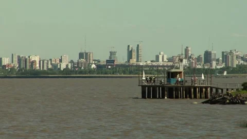 Static shot of Buenos Aires skyline behind it's harbour and a pier Stockbeeldmateriaal 160280590