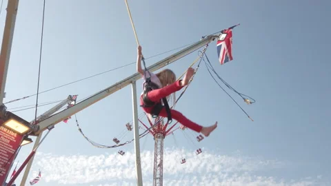 Static shot of bungee trampoline ride in Paignton UK Stock Footage 331900078
