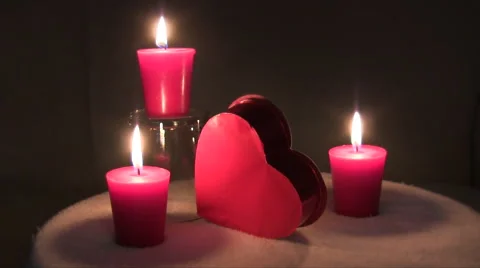 Static shot of burning red candles and candy box for Valentines day with text Stock Footage 47329579