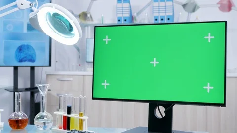 Static shot of chemist desk with a green screen mock-up desktop PC Stock Footage 110903663