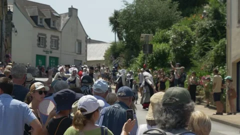 Static shot cherry festival crowd in Breton traditional dress, sunny day Stock Footage 341657946