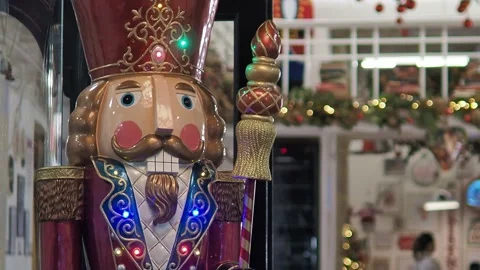 Static shot of a Christmas nutcracker soldier doll decorating an entrance. Stock Footage 166986699