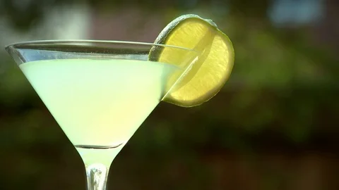 A static shot of a cocktail in the sunshine Stock Footage 87857200