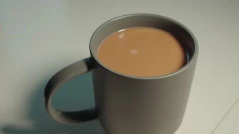 Static shot of coffee in in a gray mug on a white table Stock Footage 300204678