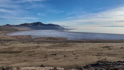 Static shot of a curved shoreline and still water at Great Salt Lake, Utah Stock Footage 338427922