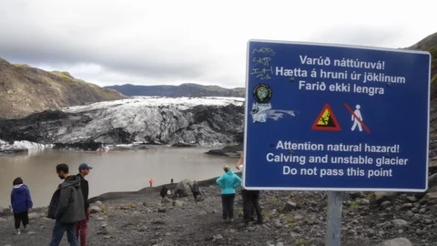 Static shot of Danger Sign w/ Solheimajokull glacier in Background Stock Footage 99010483