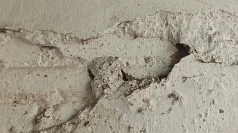 Static Shot of Deep Crack and Broken Hole on Old Concrete Wall Видео 346152458