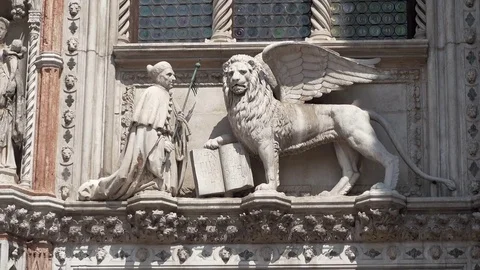 Static shot of Doge statue kneeling the Lion of St Mark, Doge Palace Stock Footage 83340048