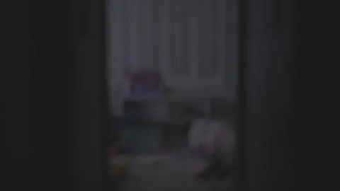 Static shot down hallway looking into children's playroom with tv on Stock Footage 306882401