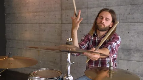Static shot of the drummer playing the drums. Man showing basic drum beats Stock Footage 155554035
