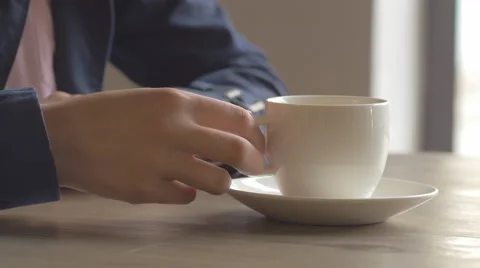 Static shot of elegant girl drinking coffee from a white cup Stock Footage 67063359