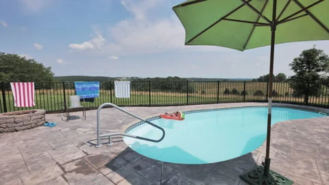 Static shot of empty relaxing pool on sunny day Stock Footage 138526233