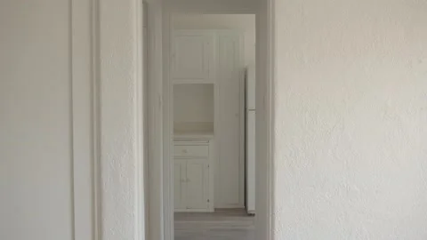 Static shot of a empty studio apartment hall looking into a kitchen Stock Footage 201588725