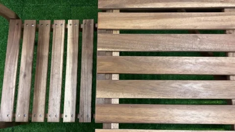 Static Shot of Empty Wooden Outdoor Table and Chairs on Green Ground Stock Footage 333472359