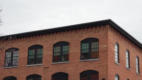 Static shot exterior of red brick refurbished factory to apartment Stock Footage 218586825