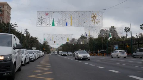 Static shot of a four lanes road downtown with a line of taxi and cars passing Stock Footage 121850378